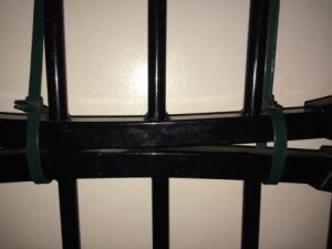Hold gates together so they open like a normal swinging door.